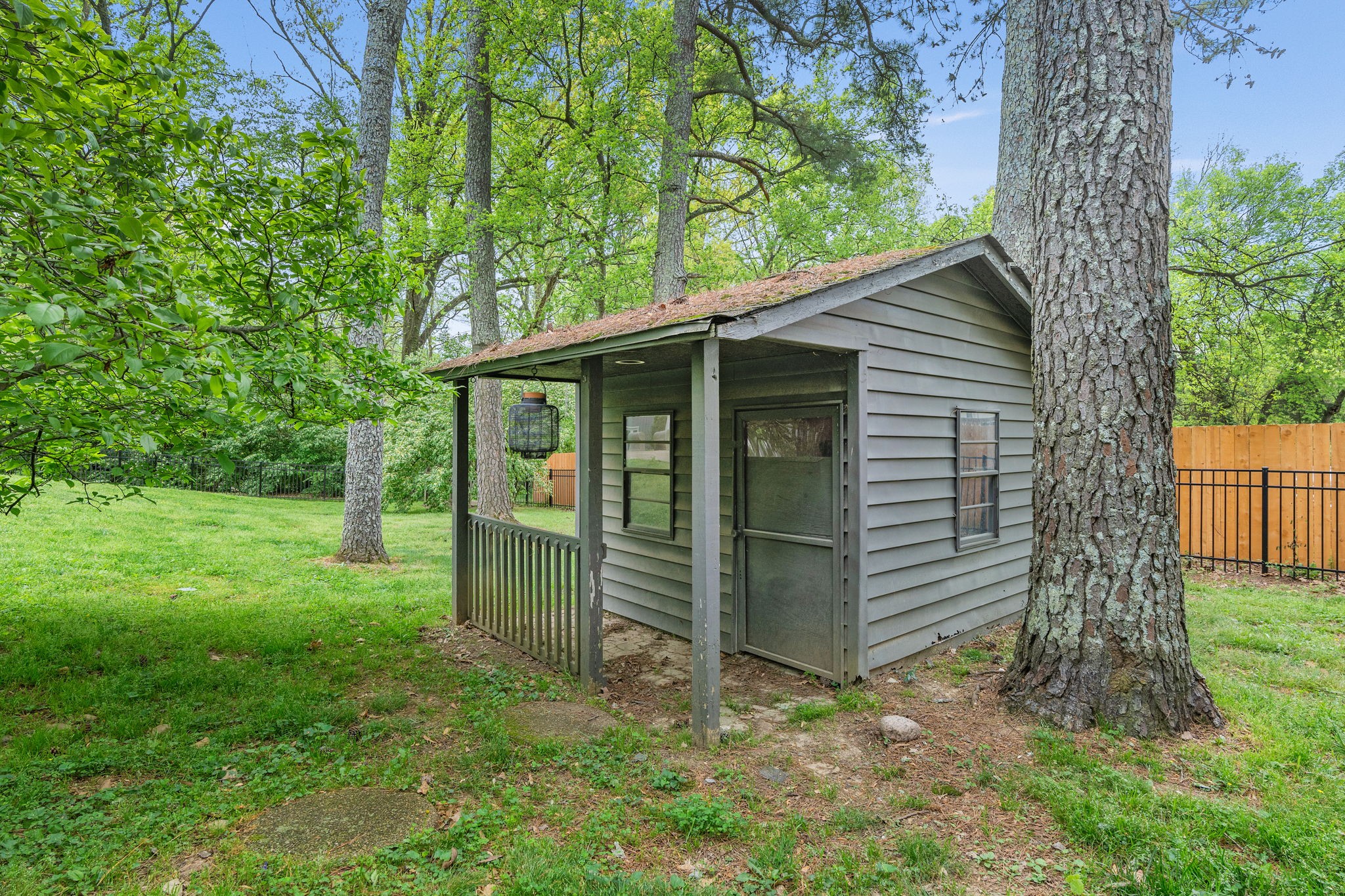 1004 Hickory Hollow Road Nashville, TN 37221 - Photo 35 of 41 a view of a small house with a small barn and wooden fence