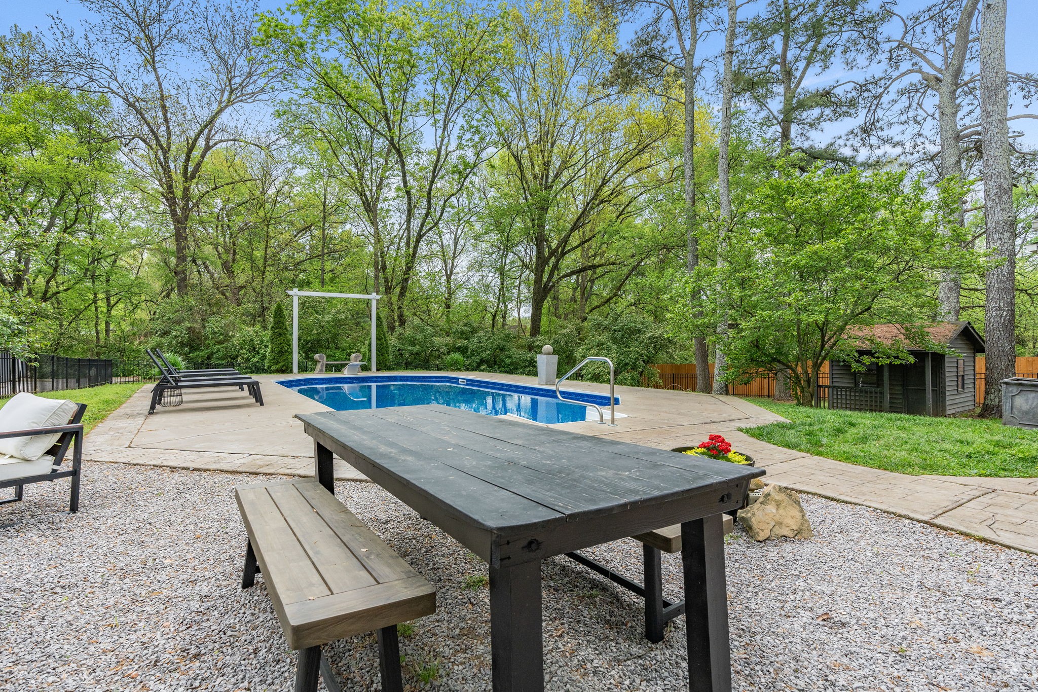 1004 Hickory Hollow Road Nashville, TN 37221 - Photo 36 of 41 a view of a patio with table and chairs with wooden fence and floor