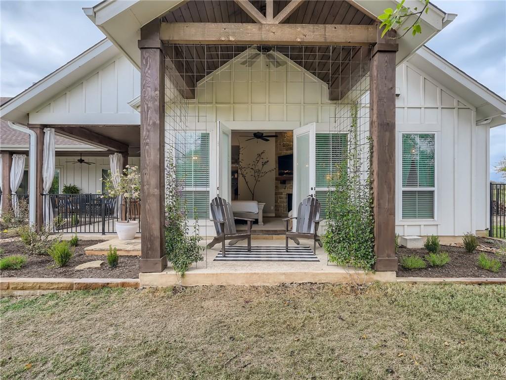 132 Huerta Road Florence, TX 76527 - Photo 32 of 40 A private back porch with a covered seating area provides a serene outdoor retreat.