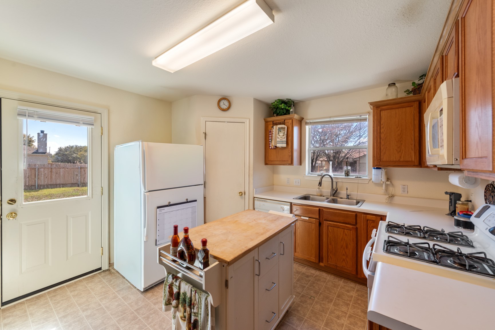 5501 English Avenue Austin, TX 78724 - Photo 7 of 19 a kitchen with a sink stove and refrigerator