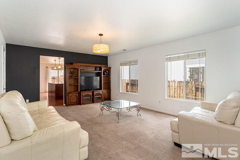 7725 Tulear Street Reno, NV 89506 - Photo 3 of 16 a living room with furniture and a large window