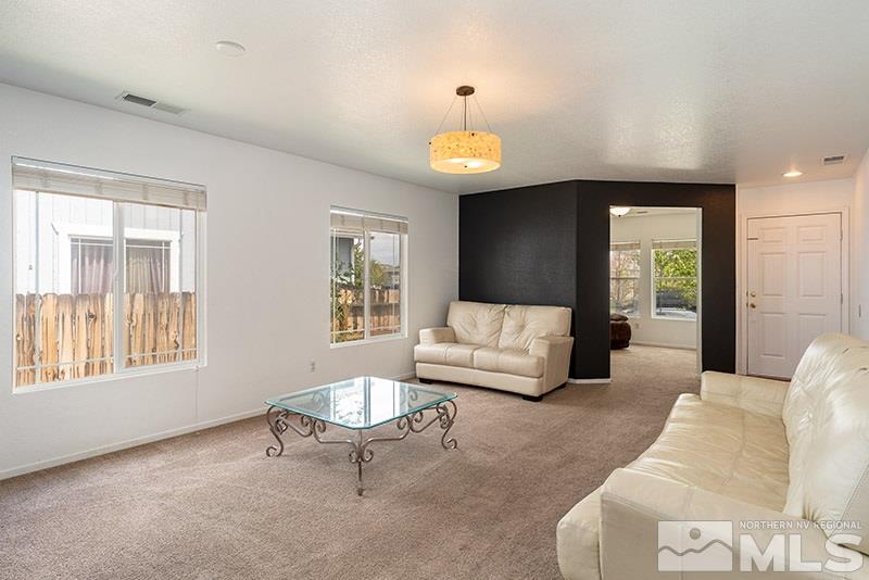 7725 Tulear Street Reno, NV 89506 - Photo 4 of 16 a living room with furniture and a large window