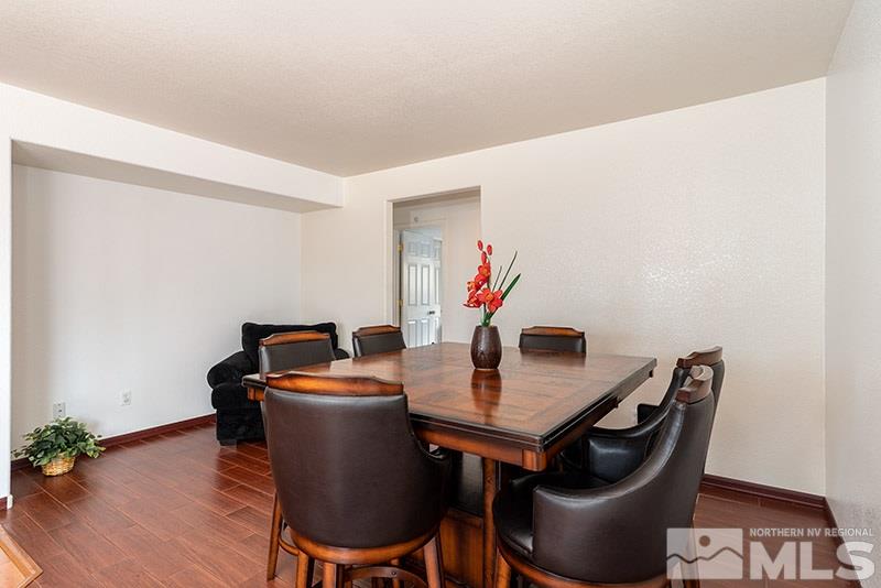 7725 Tulear Street Reno, NV 89506 - Photo 8 of 16 a dining room with furniture and wooden floor