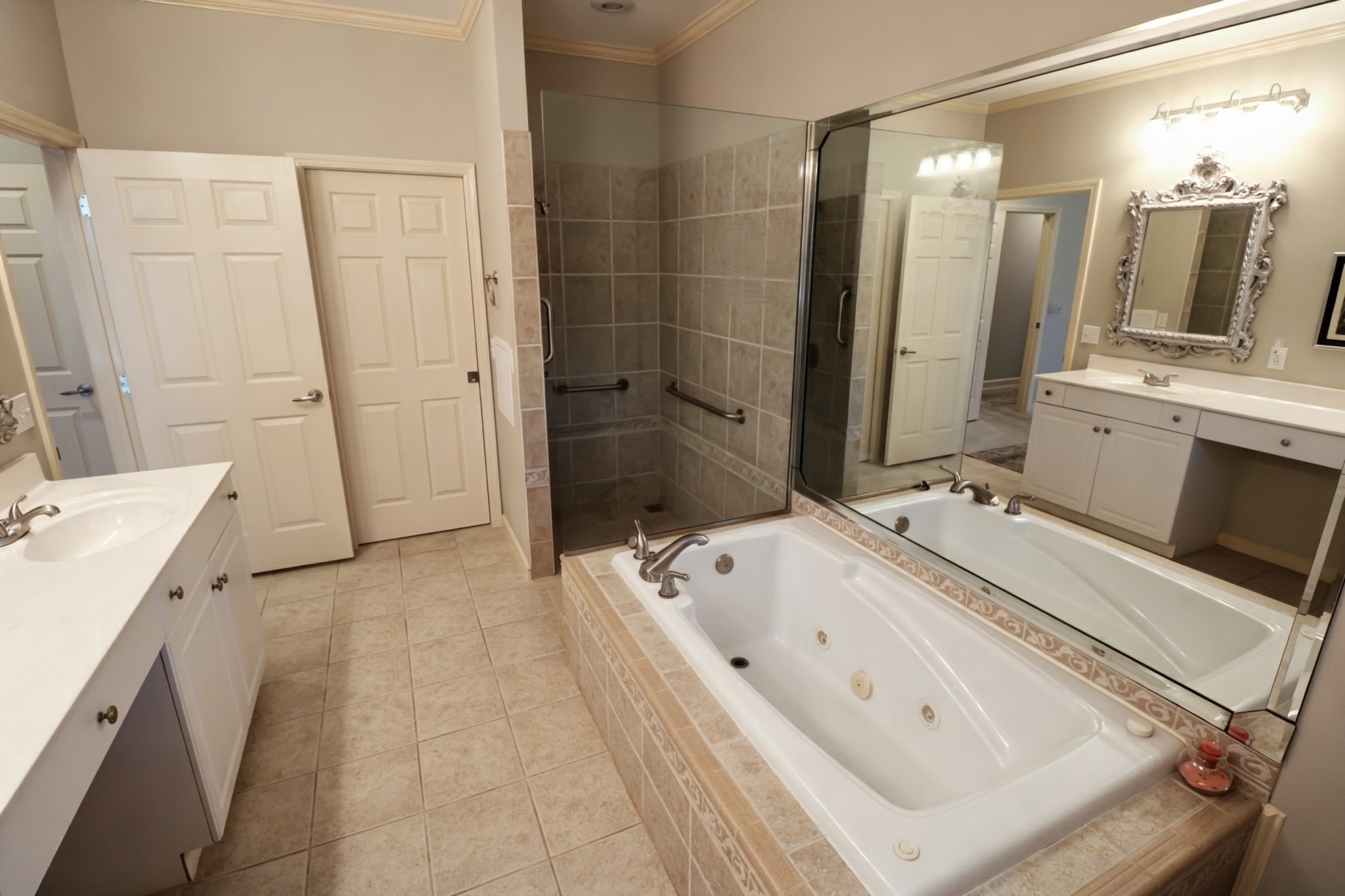 19 Emerald Cove, Unit B Paris, TN 38242 - Photo 14 of 24 a en suite spacious bathroom with a tub sink and mirror