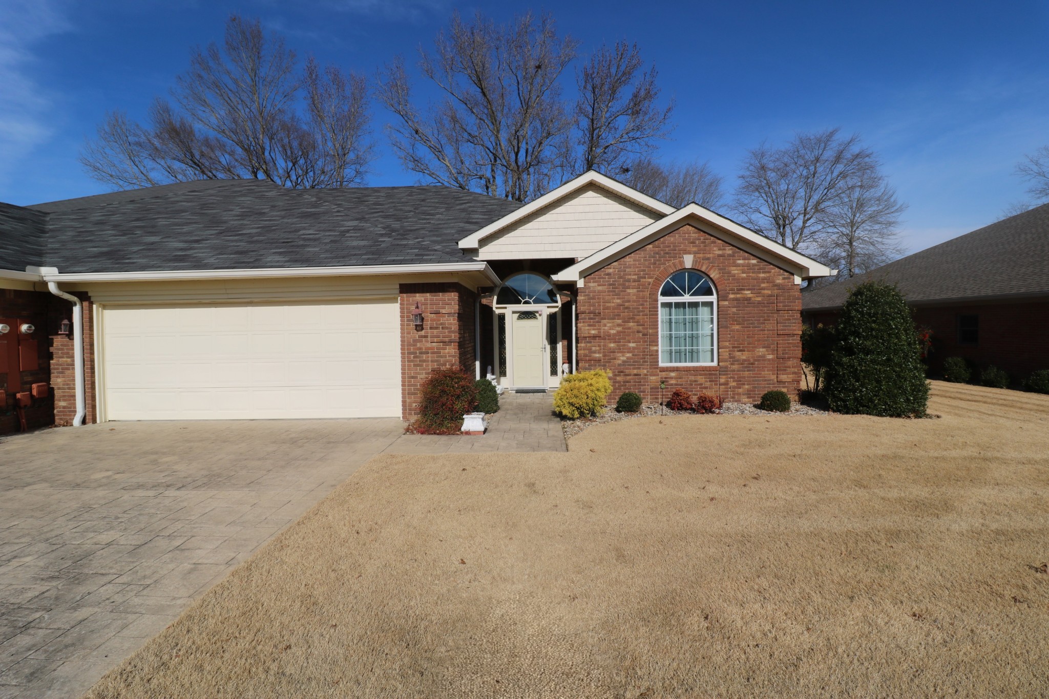 19 Emerald Cove, Unit B Paris, TN 38242 - Photo 24 of 24 a front view of a house with a yard and garage