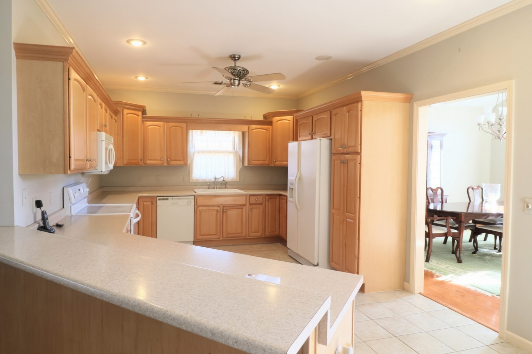 19 Emerald Cove, Unit B Paris, TN 38242 - Photo 7 of 24 a kitchen with stainless steel appliances a sink a counter top space cabinets and a dining table
