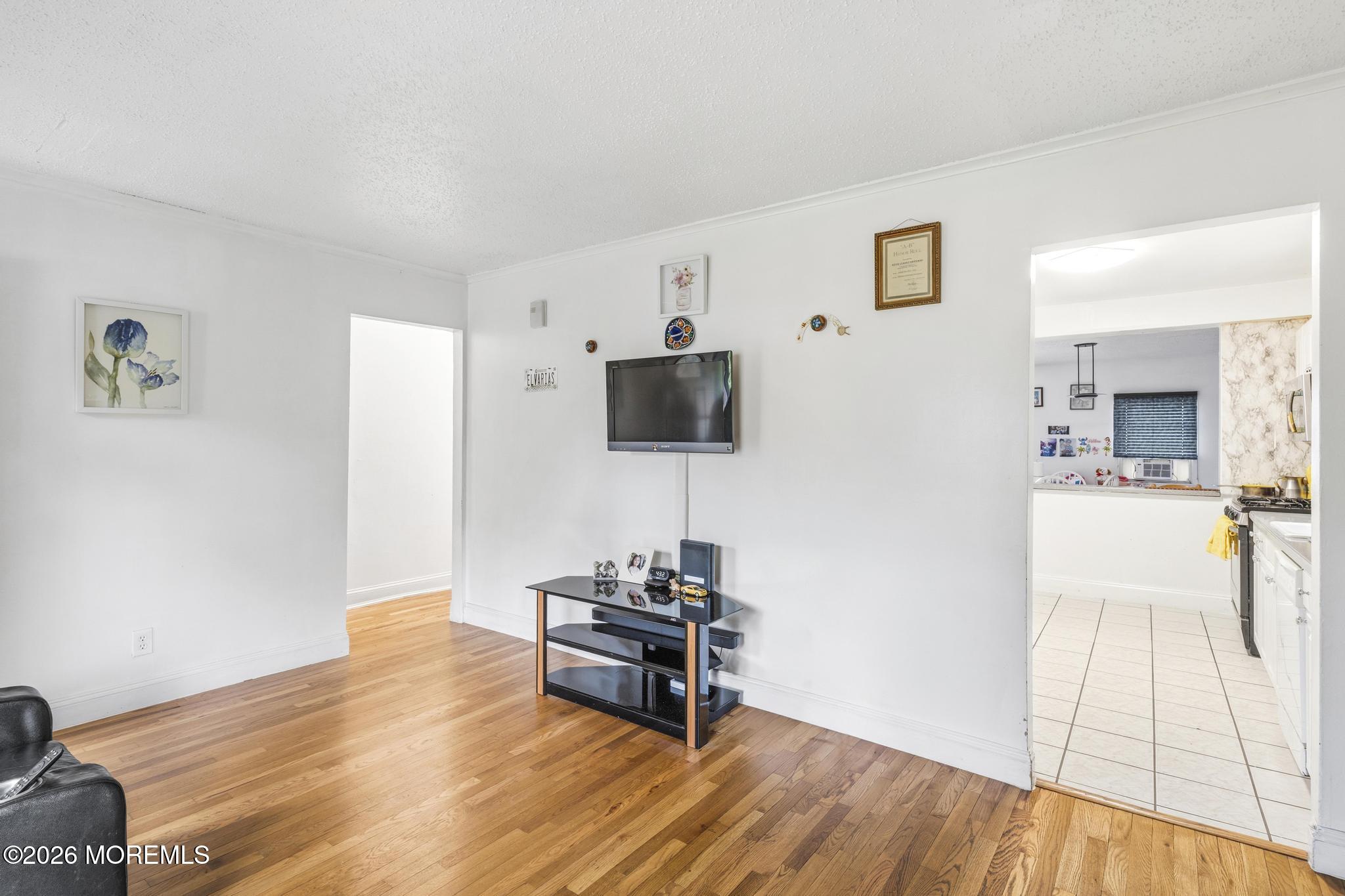 1914 Rutherford Avenue Neptune Township, NJ 07753 - Photo 6 of 25 a living room with furniture and a flat screen tv