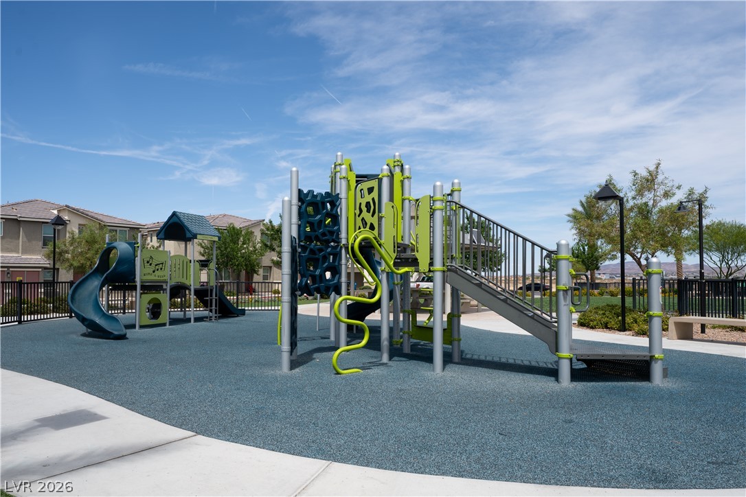 12267 Desert Light Road, Unit 4 Las Vegas, NV 89183 - Photo 14 of 18 A vibrant neighborhood playground with modern equipment offers recreational space for residents.