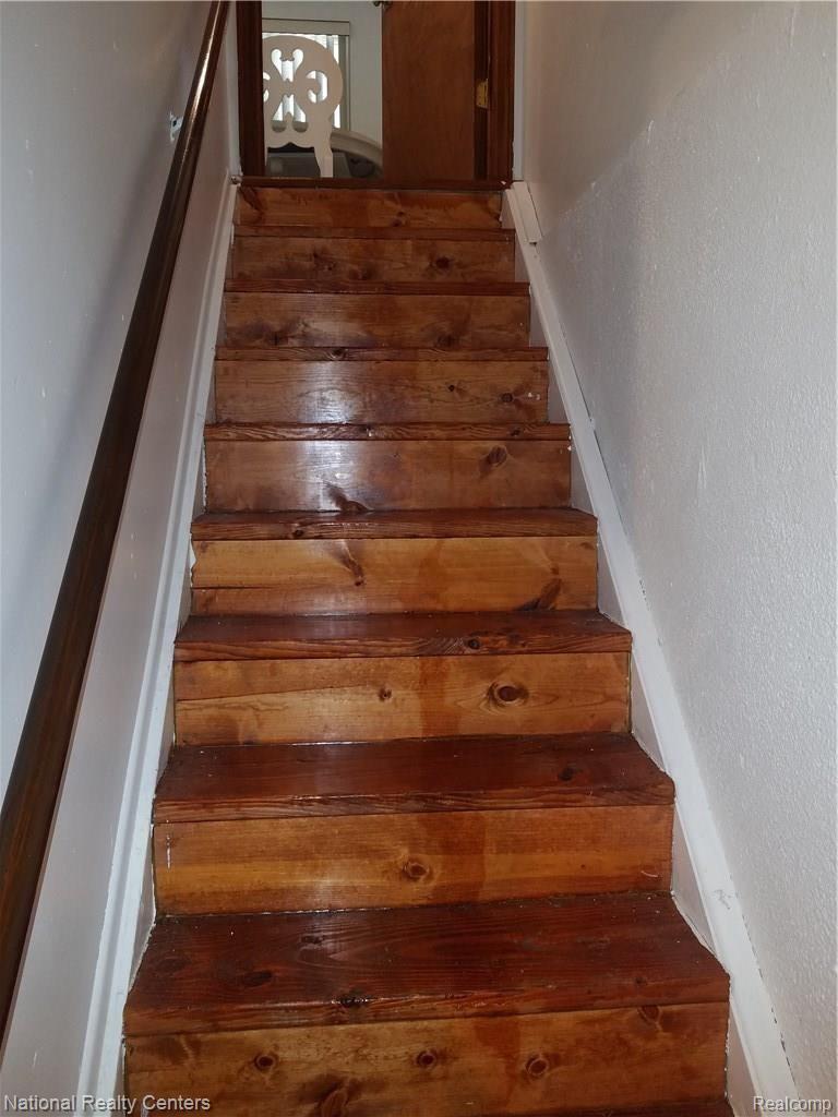 27045 Harvard Road Southfield, MI 48076 - Photo 51 of 66 Basement Hardwood stairs