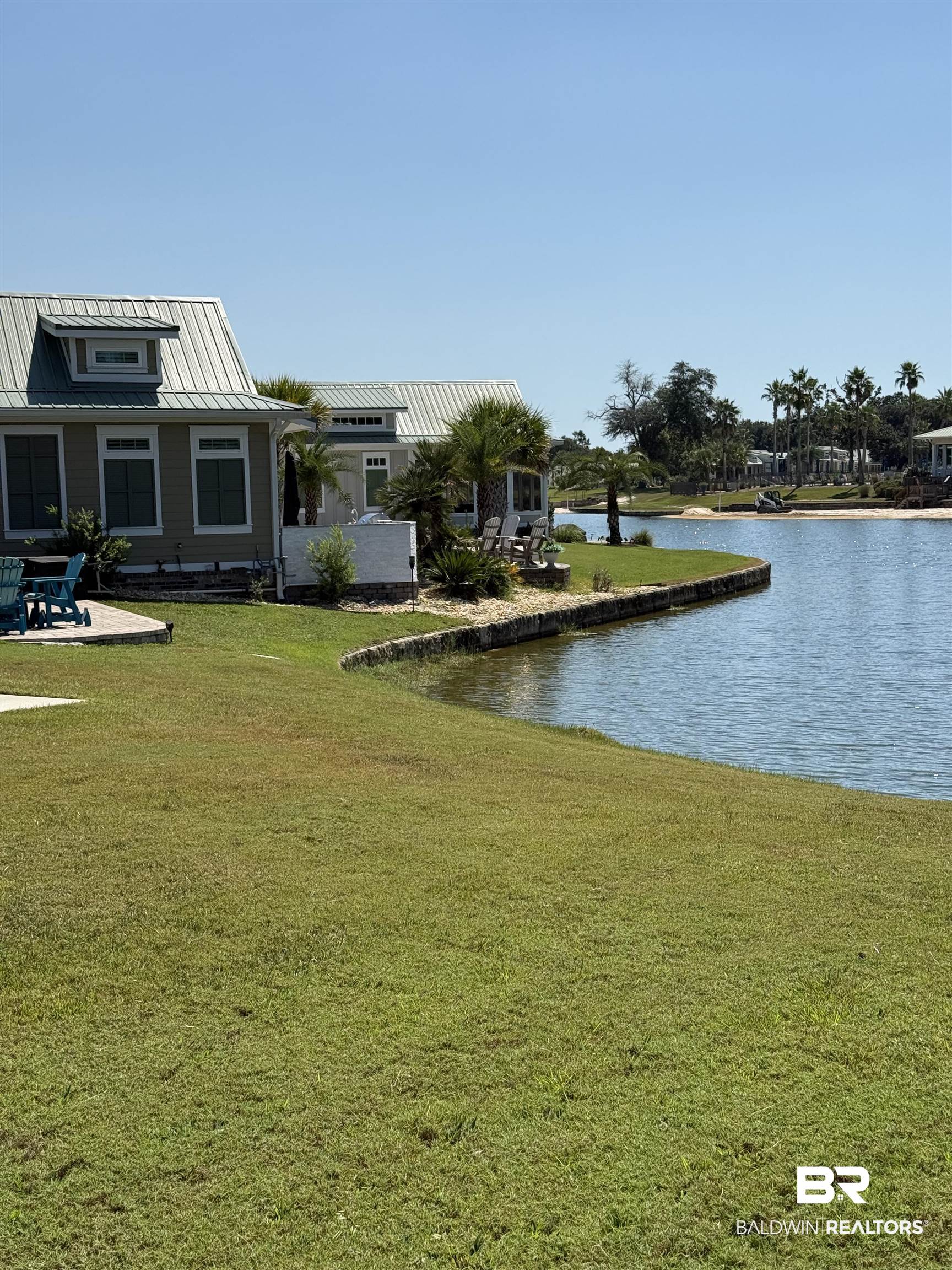 28086 Migratory Way Elberta, AL 36530 - Photo 17 of 46 View of green lawn with a water view and a patio