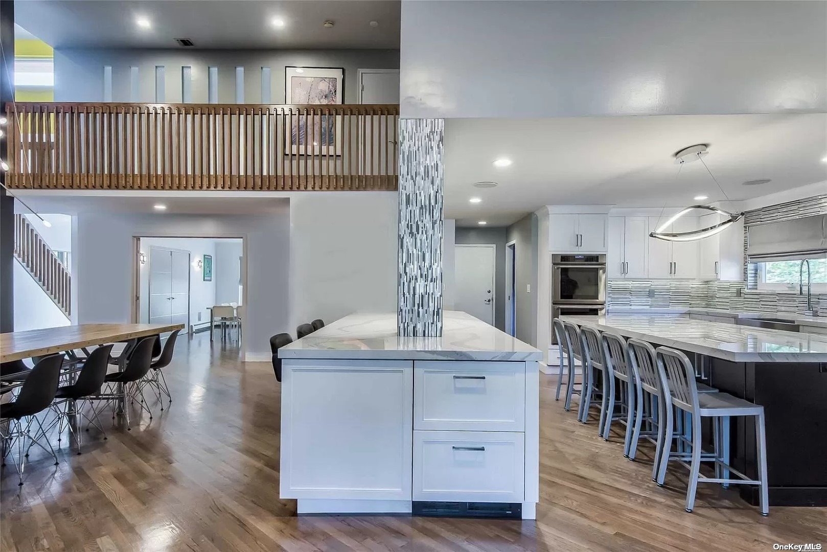 a kitchen with kitchen island granite countertop a table and chairs