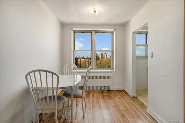 a view of a dining room with furniture window and wooden floor