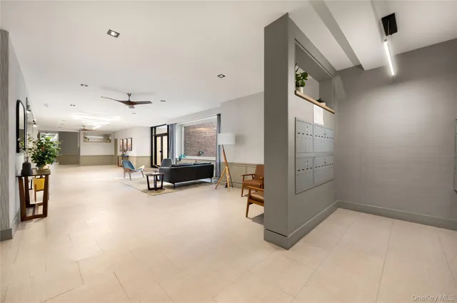 en empty room with furniture and a window