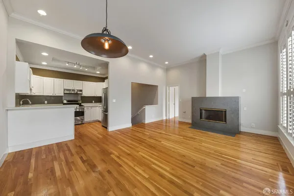 a view of kitchen with cabinets and wooden floor