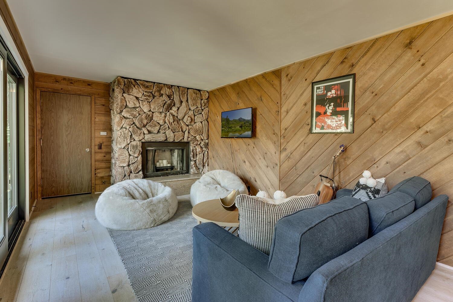 126 Tiger Tail Road Olympic Valley, CA 96146 - Photo 19 of 28 a living room with furniture and a fireplace