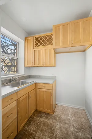 a kitchen with a sink and cabinets