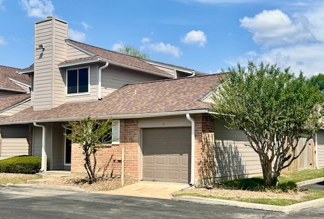 14020 Schroeder Road, Unit 151 Houston, TX 77070 - Photo 2 of 26 a front view of a house with a yard
