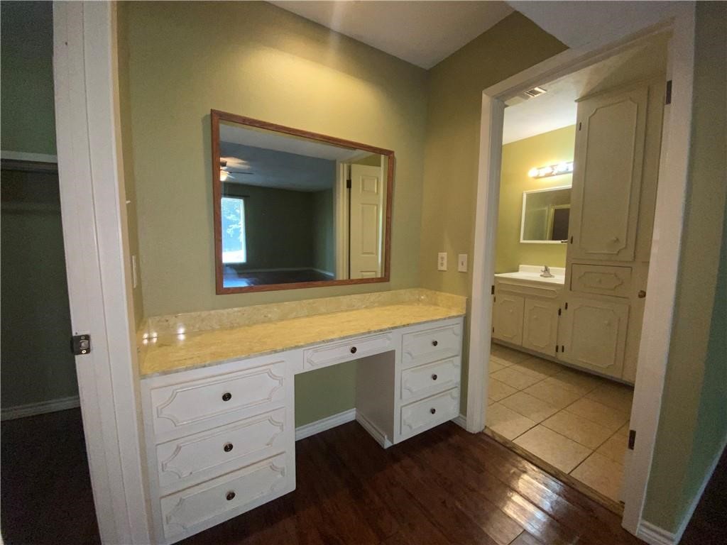 310 Sunset Boulevard Portland, TX 78374 - Photo 7 of 18 a bathroom with a double vanity sink and mirror