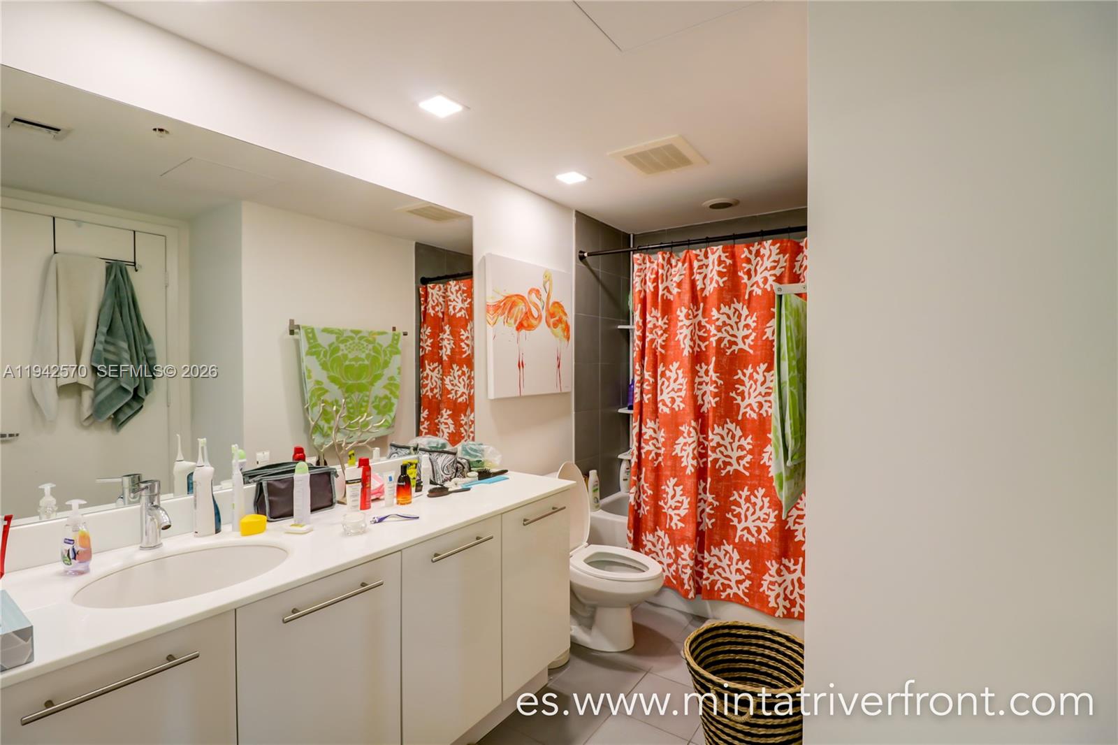 92 Southwest 3rd Street, Unit 1902 Miami, FL 33130 - Photo 5 of 9 a bathroom with a sink mirror vanity and toilet
