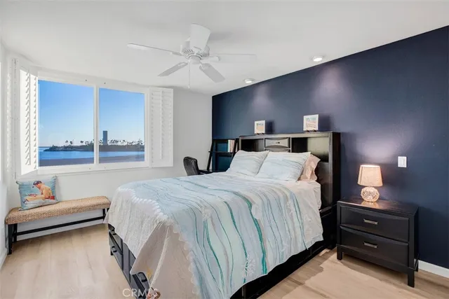 a large bed sitting in a room next to a lamp