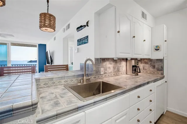a kitchen with a stove and a sink