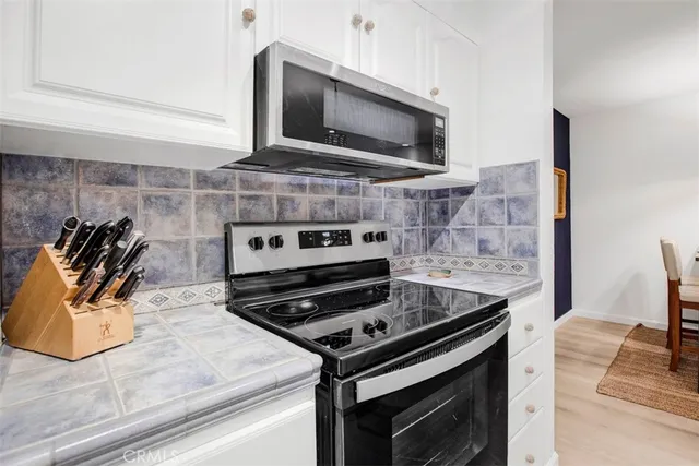 a dining room with a table and chairs
