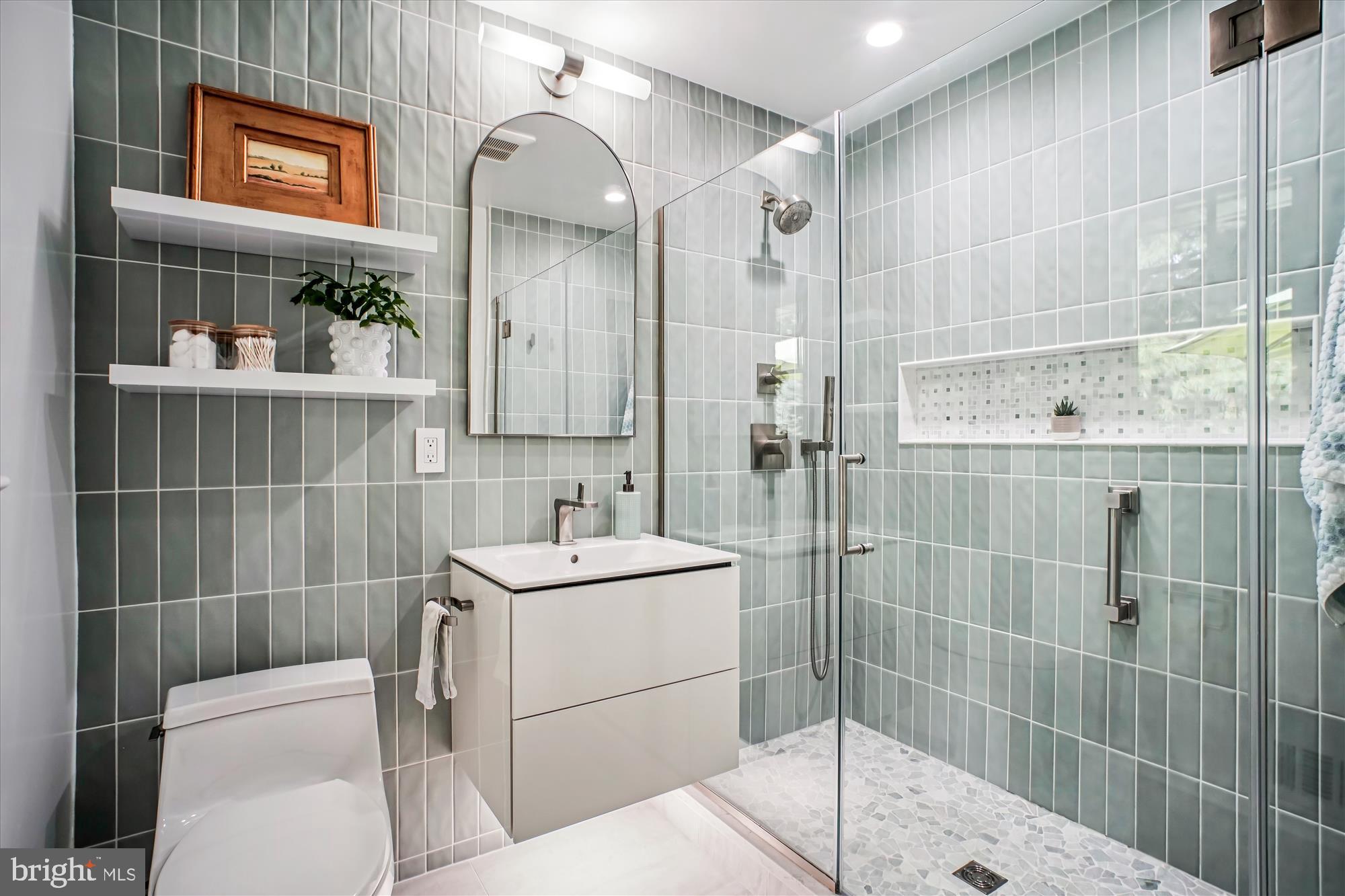 3717 Chanel Road Annandale, VA 22003 - Photo 19 of 57 a bathroom with a sink a toilet and shower