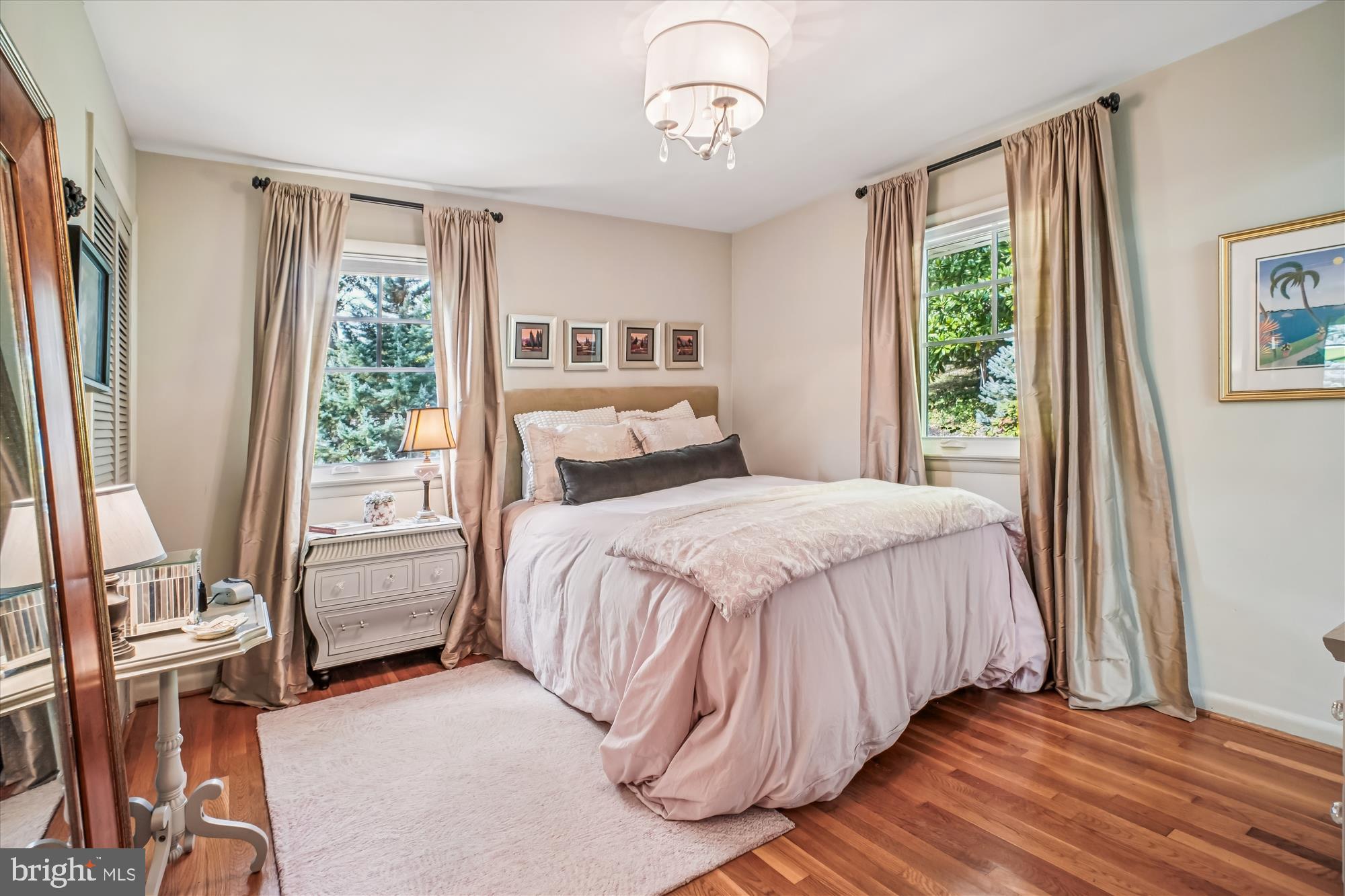 3717 Chanel Road Annandale, VA 22003 - Photo 22 of 57 a bedroom with a bed next to a large window with the outer view