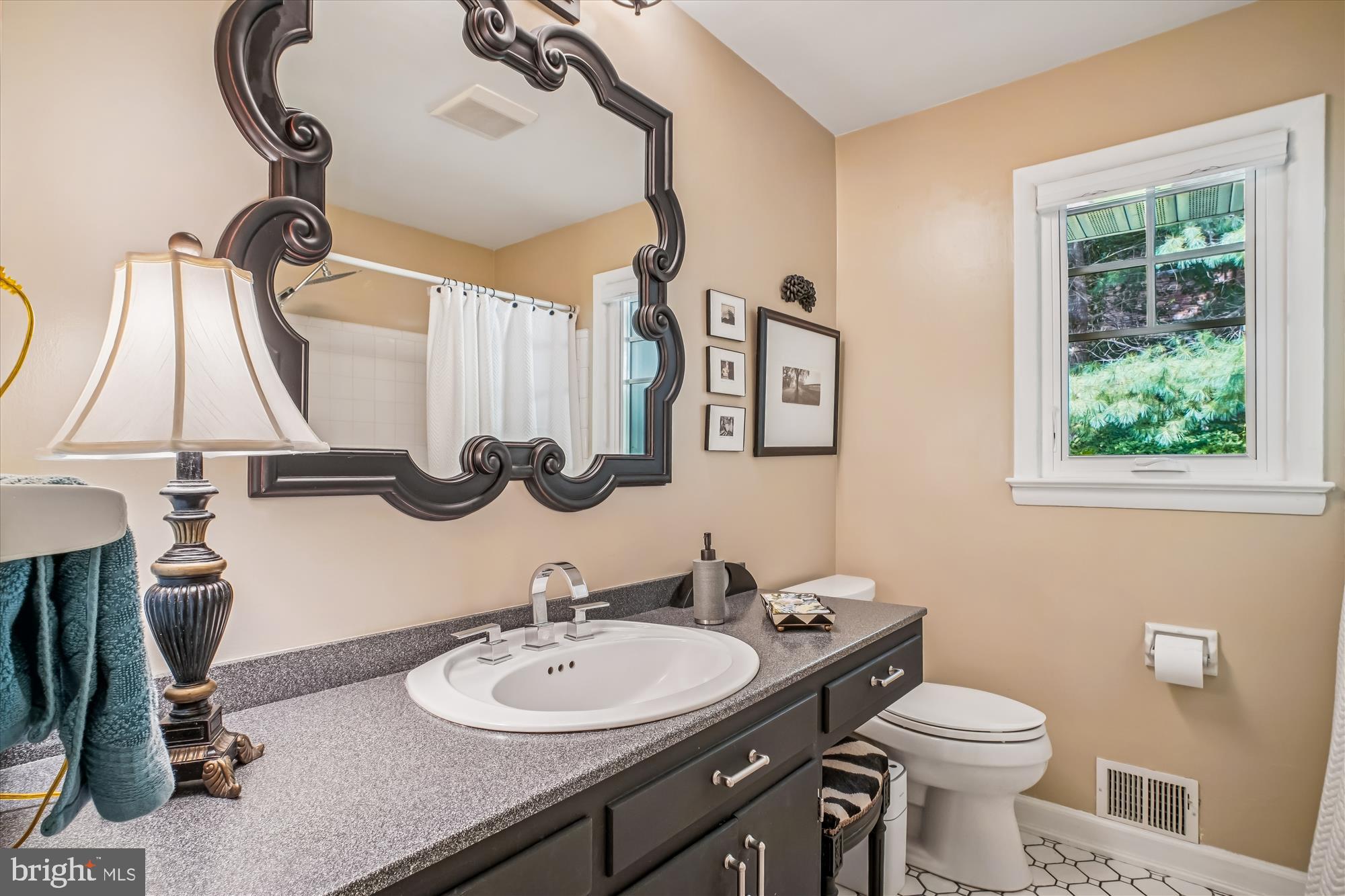 3717 Chanel Road Annandale, VA 22003 - Photo 26 of 57 a bathroom with a toilet sink and mirror