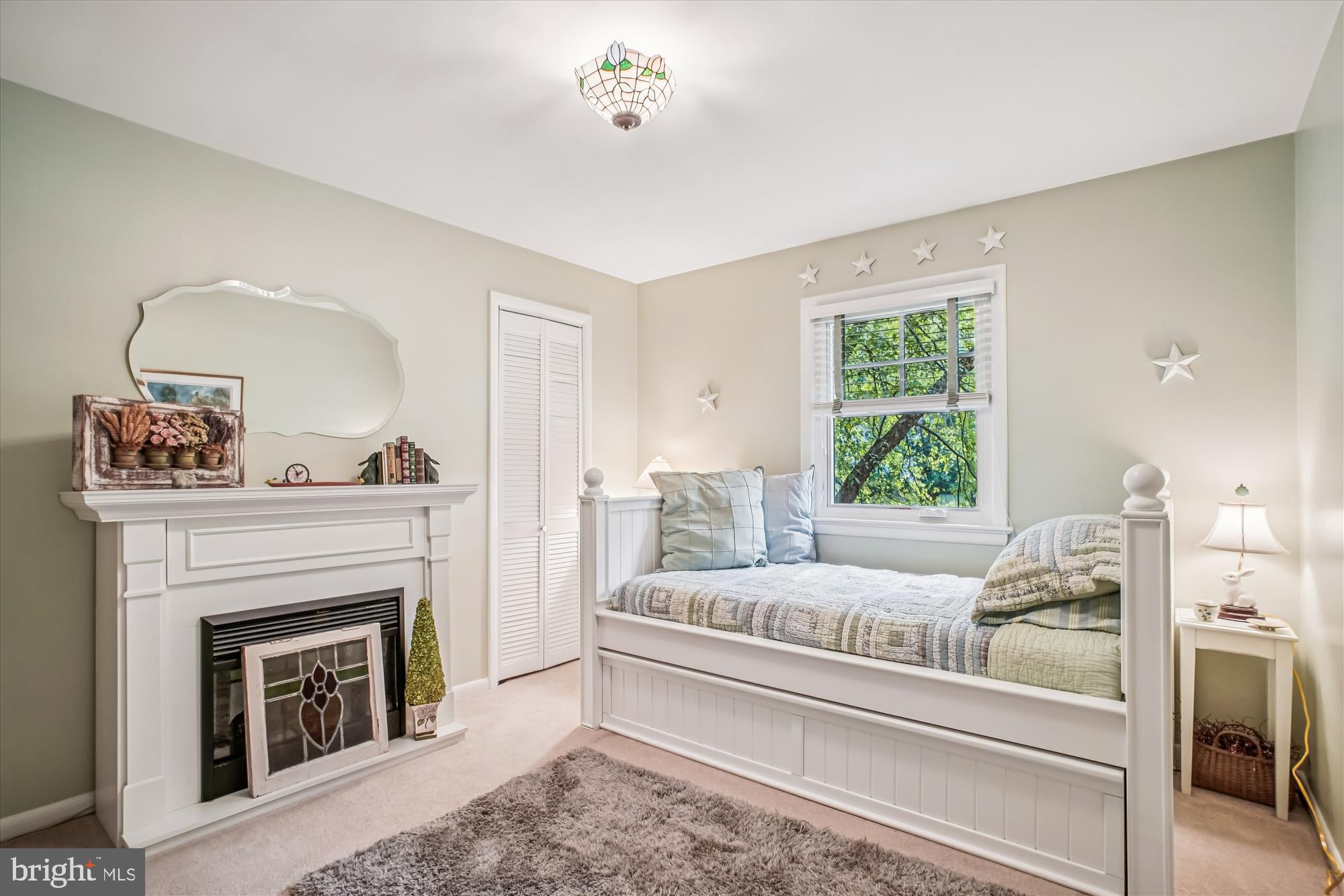 3717 Chanel Road Annandale, VA 22003 - Photo 29 of 57 a living room with furniture and a fireplace