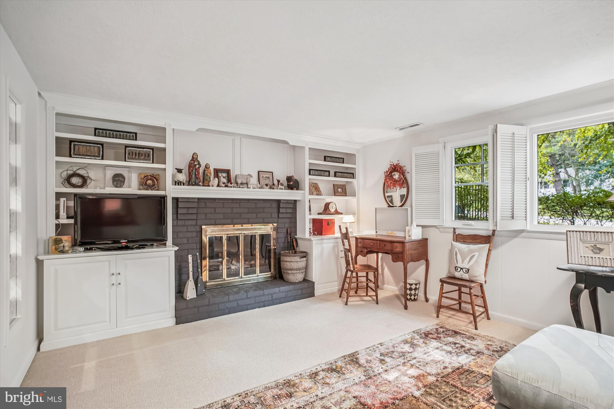 3717 Chanel Road Annandale, VA 22003 - Photo 36 of 57 a living room with furniture a flat screen tv and kitchen view