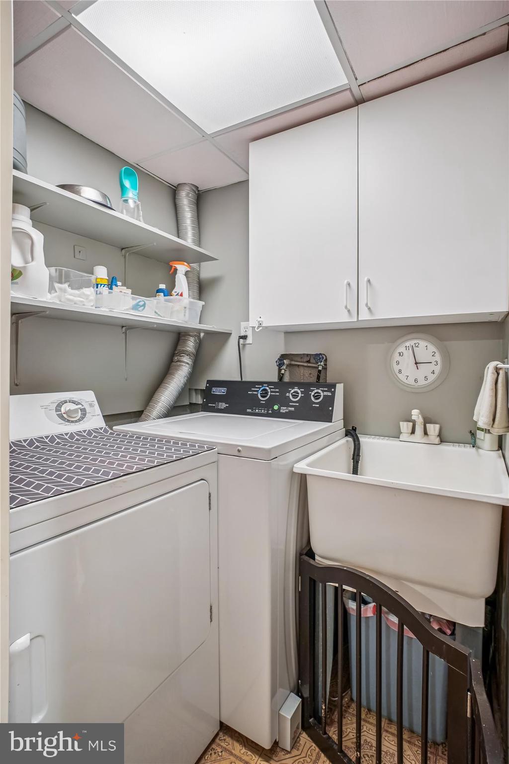 3717 Chanel Road Annandale, VA 22003 - Photo 40 of 57 a kitchen with a sink a stove cabinets and utility