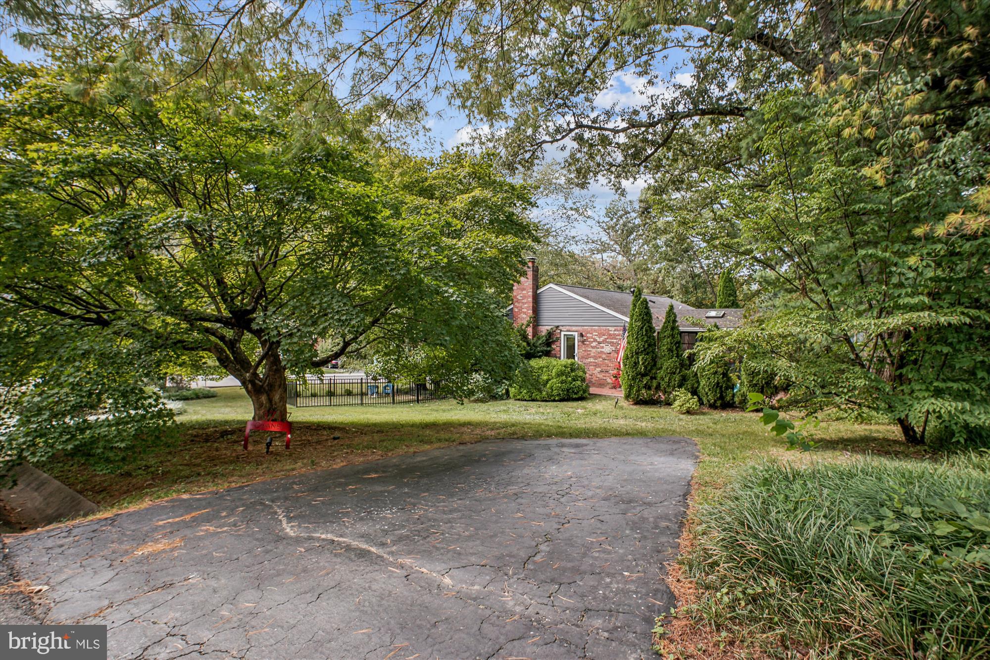 3717 Chanel Road Annandale, VA 22003 - Photo 50 of 57 a front view of a house with a yard and a trees