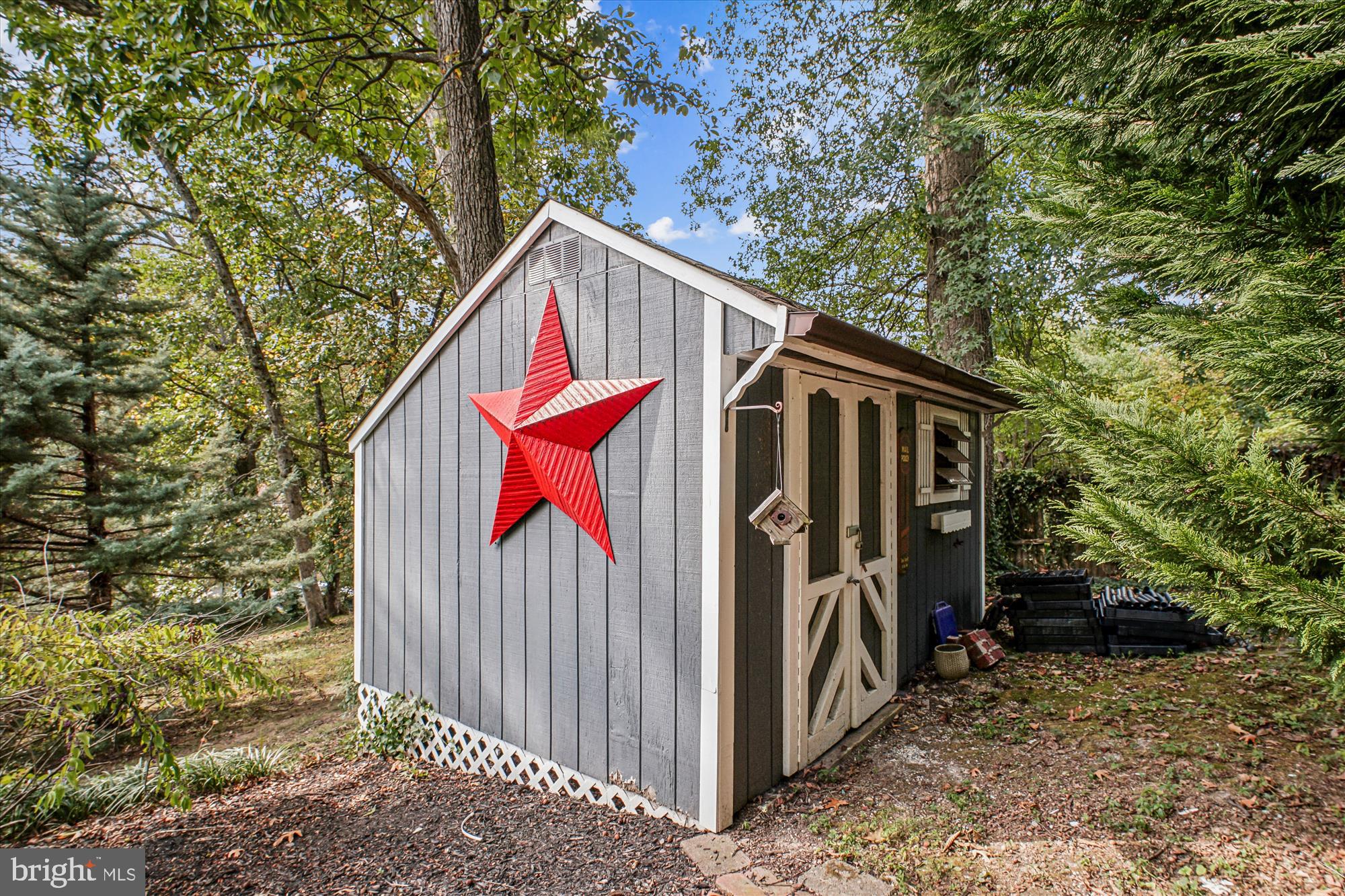 3717 Chanel Road Annandale, VA 22003 - Photo 51 of 57 a view of small house with large trees and wooden fence