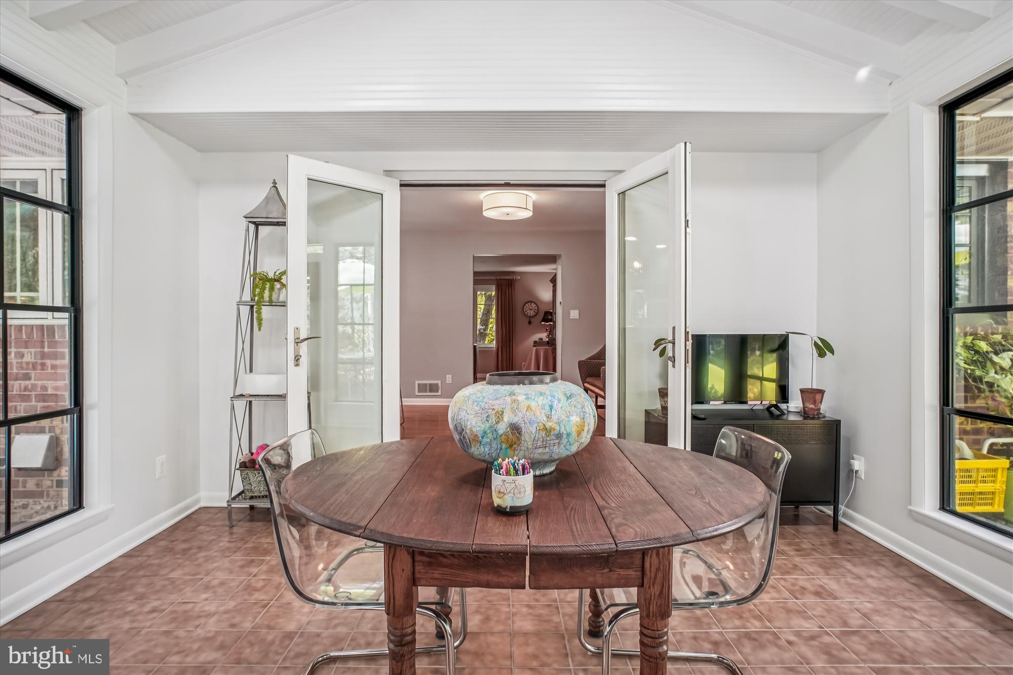 3717 Chanel Road Annandale, VA 22003 - Photo 9 of 57 a view of a dining room with furniture and a potted plant