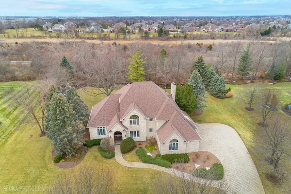 a view of a lake with a house in the background