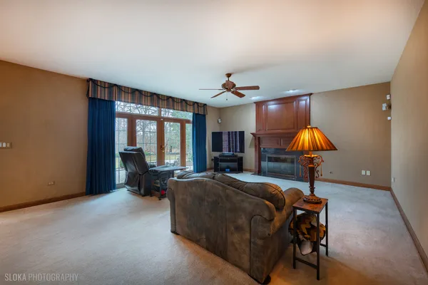 a bedroom with furniture and a chandelier