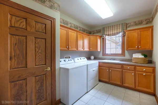 a kitchen with stainless steel appliances granite countertop a sink and cabinets