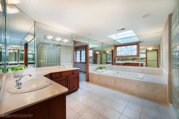 a kitchen with stainless steel appliances granite countertop a sink and a refrigerator