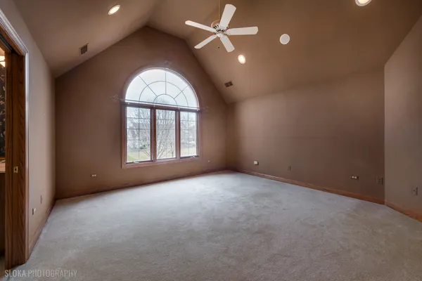 an empty room with a empty space and windows