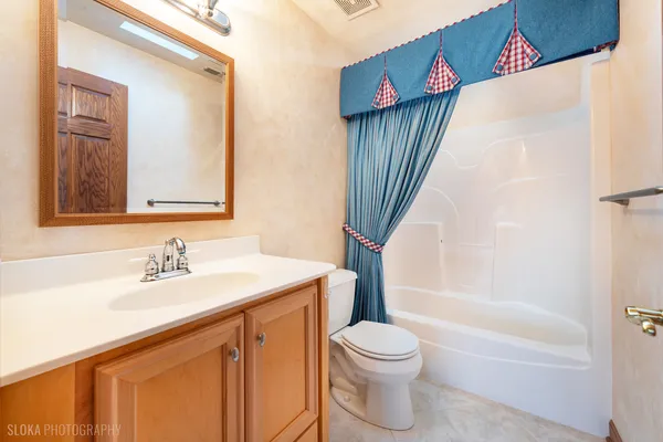 a bathroom with a sink a toilet and a bathtub