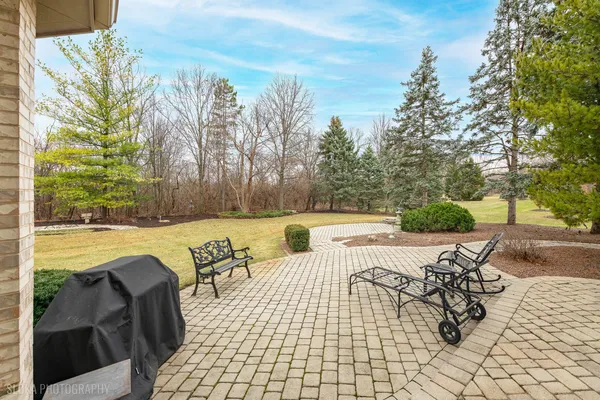 a view of swimming pool with outdoor seating and plants