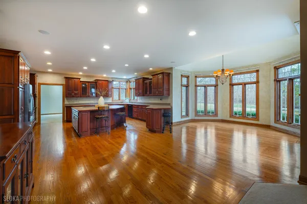 a swimming pool with kitchen view and a large window