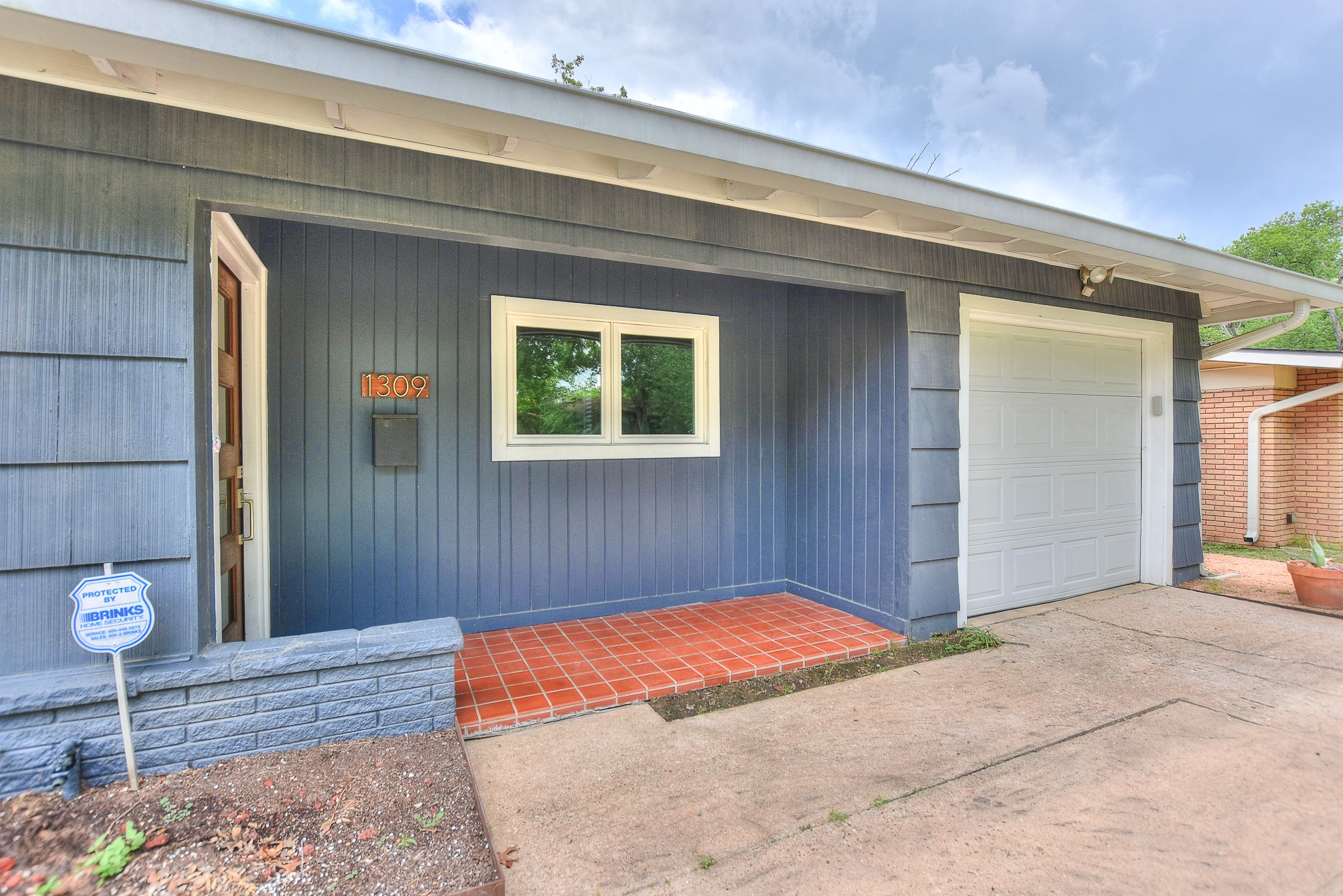 1309 Ridgemont Drive Austin, TX 78723 - Photo 4 of 35 Covered front porch welcomes you home to this mid-century modern charmer!
