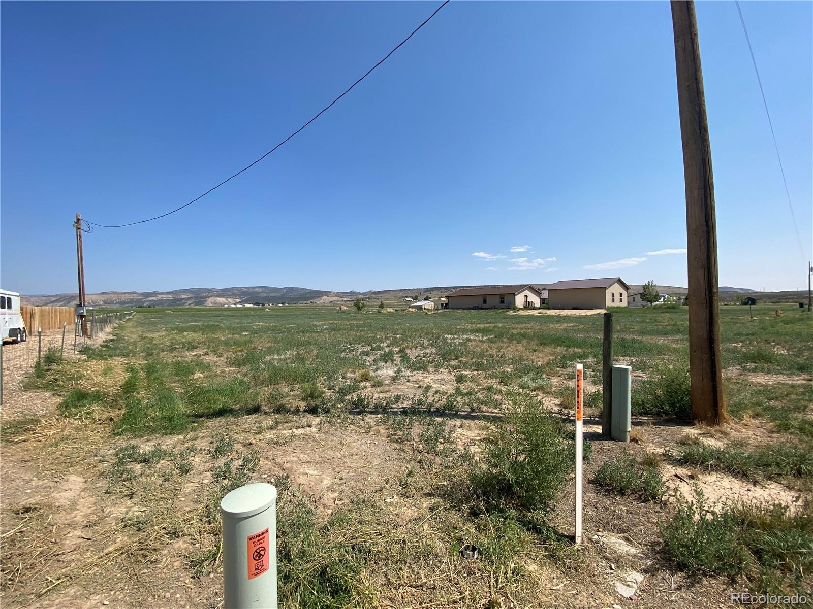 101 County Road Rangely, CO 81648 - Photo 2 of 8 a view of a city from a yard