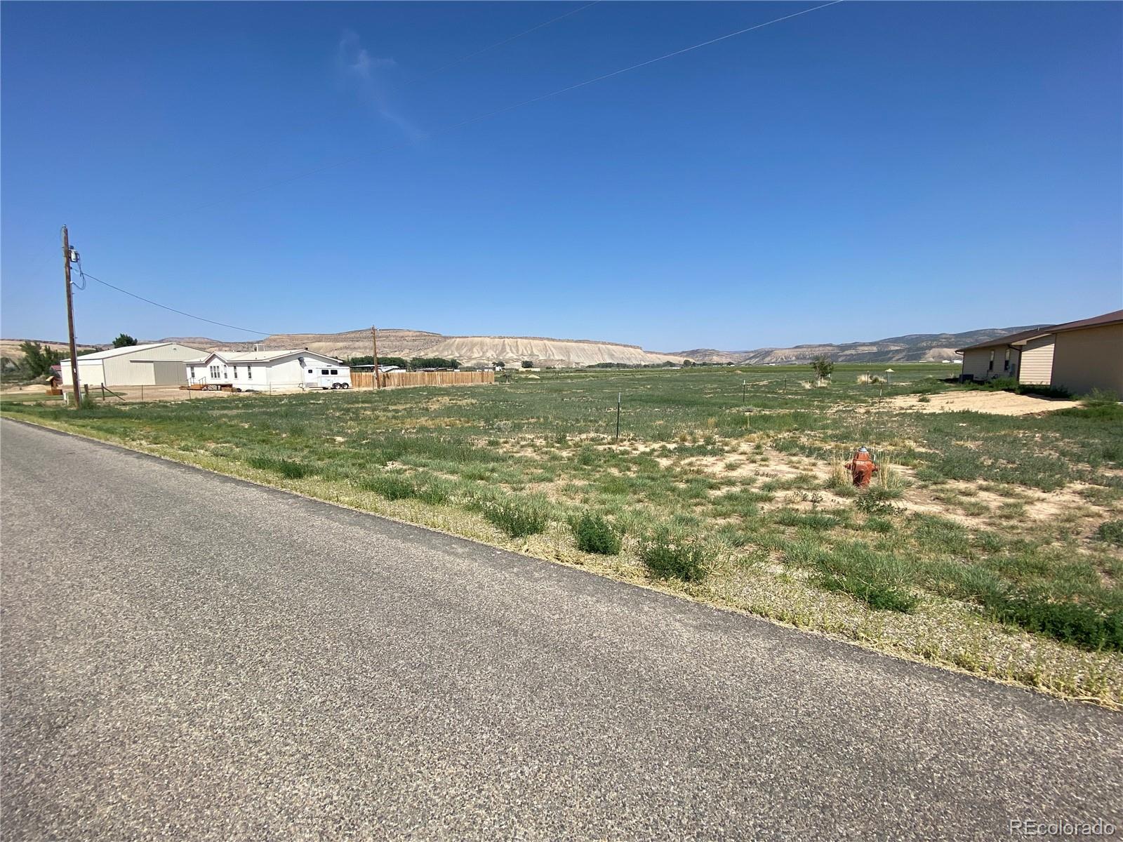 101 County Road Rangely, CO 81648 - Photo 6 of 8 a view of a field with an ocean view