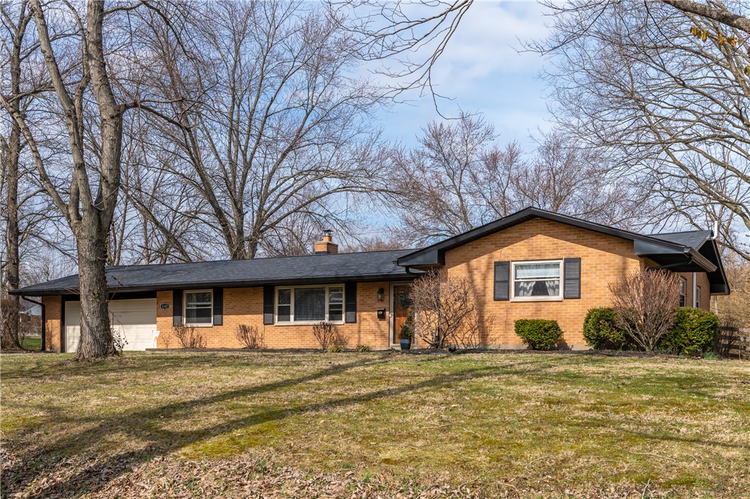4102 Ridgetop Drive Bellbrook, OH 45305 - Photo 33 of 33 This classic brick residence offers comfort and curb appeal.