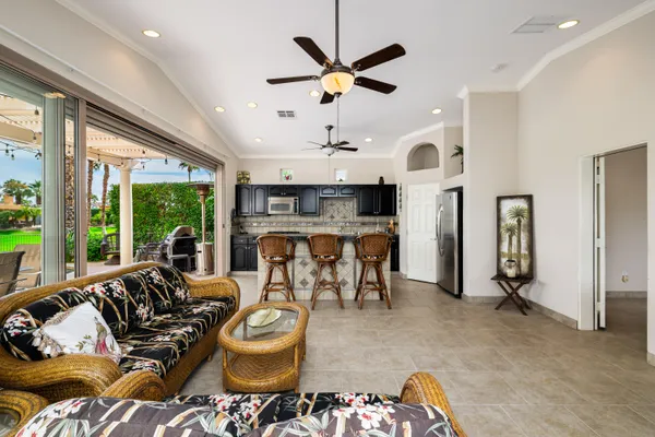 a living room with furniture and a large window