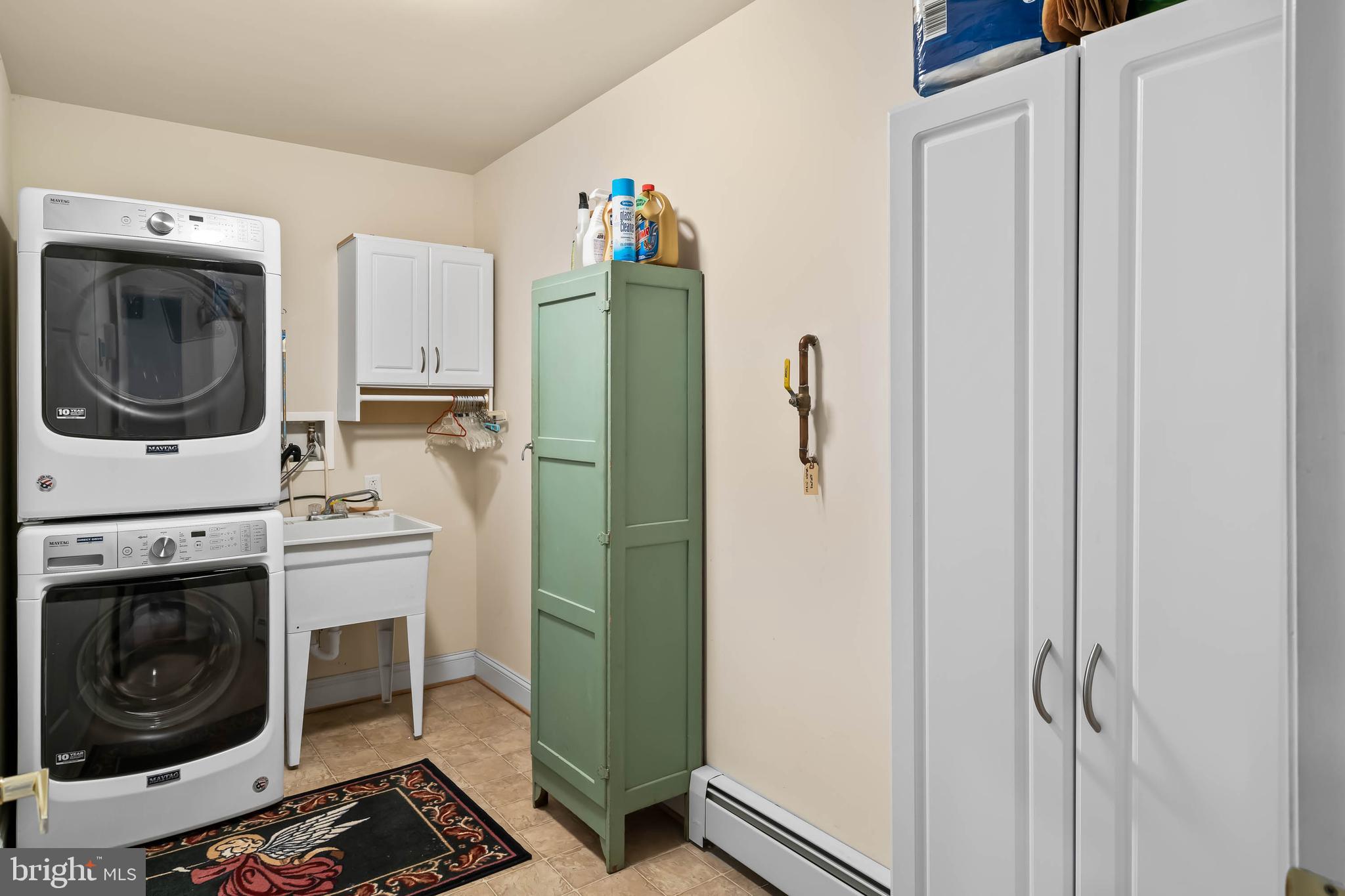 5 Canvasback Circle Bridgeville, DE 19933 - Photo 32 of 63 Laundry Room w/stacking washer and dryer and sink