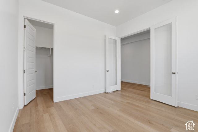 538 North Legend Circle, Unit 505 Mapleton, UT 84664 - Photo 10 of 48 Light wood-finish flooring, recessed lighting, white interior walls, white trim, and white paneled doors